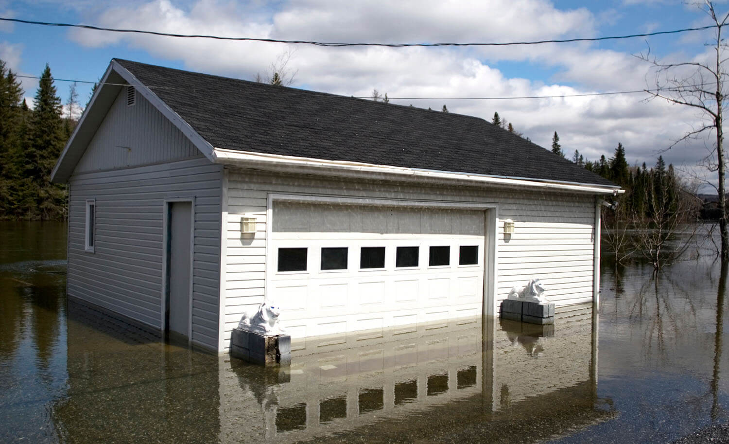 flooding due to rising rivers, engulfing a garage in knee high water