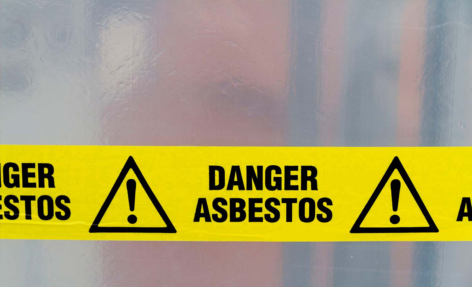 Danger asbestos tape sealing entry.