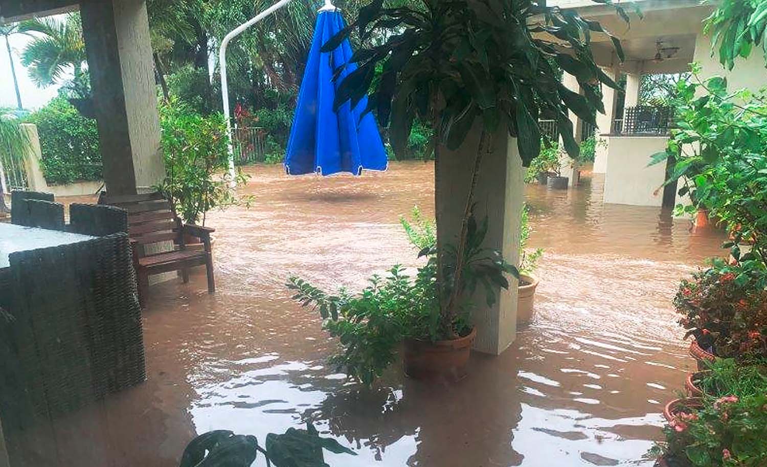 High flood water outside a home property in Townsville, QLD